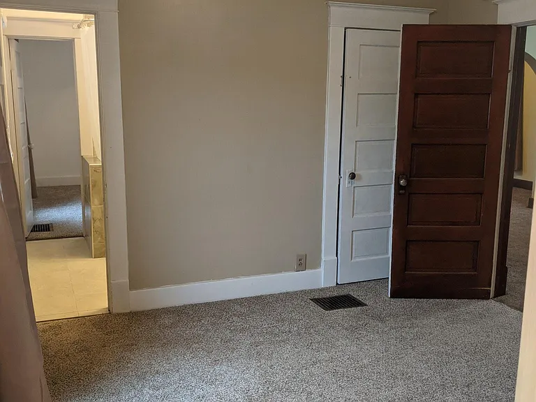 Bedroom #2. Connects to Bedroom #1 and bathroom.
