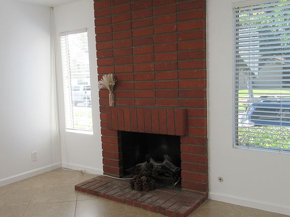 Living room fireplace, now painted white