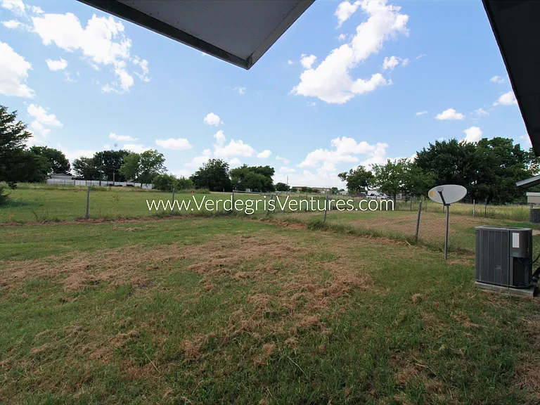 Backyard is fenced in with chainlink fence and there are no neighbors behind and to the south of the property