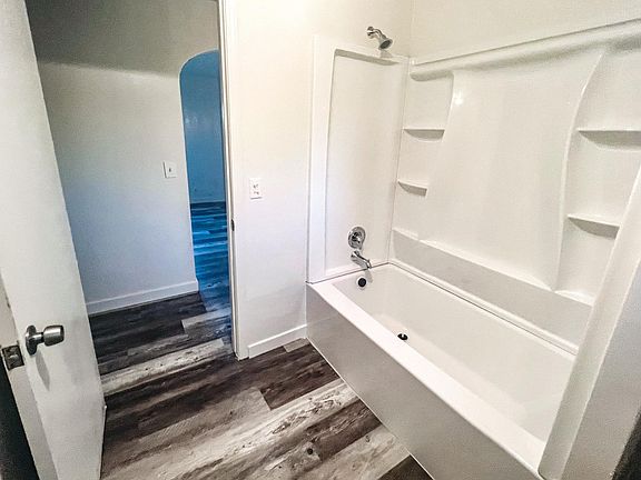 Updated bathroom with new fixtures, new tub, new toilet, new vanity, new flooring, and a fresh coat of paint!