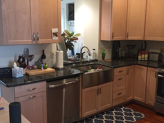 Kitchen has maple cabinets, stainless appliances and granite countertops