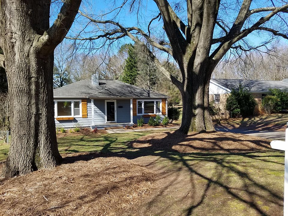 Beautiful trees frame the front yard.