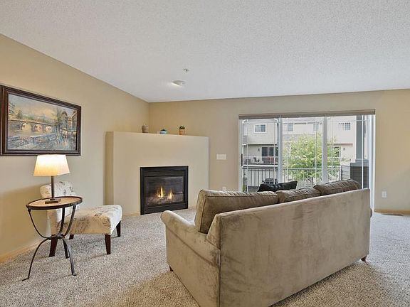 Gas fireplace and sliding doors leading to the deck.