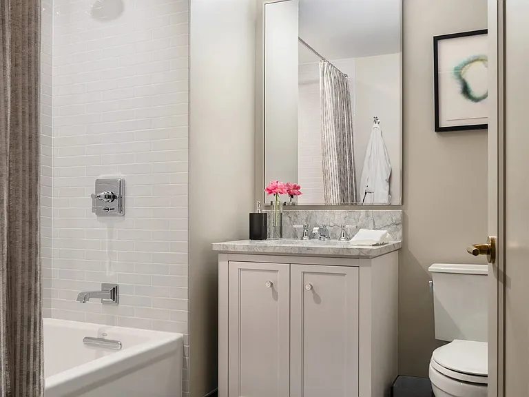 Second bathroom allows extra space and storage for family and guests.