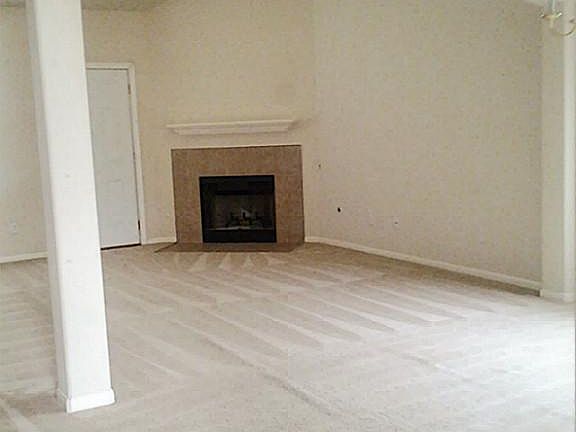 You're welcomed by the warm and inviting living room which features gas fireplace