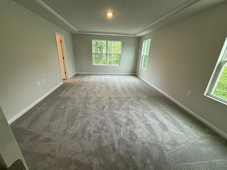 Primary bedroom with lots of natural light