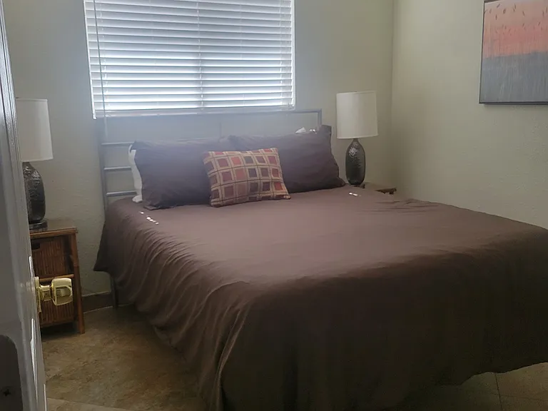 Queen bed and nightstands in 2nd bedroom.
