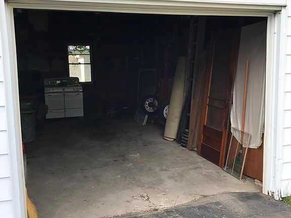 Garage door up showing interior.