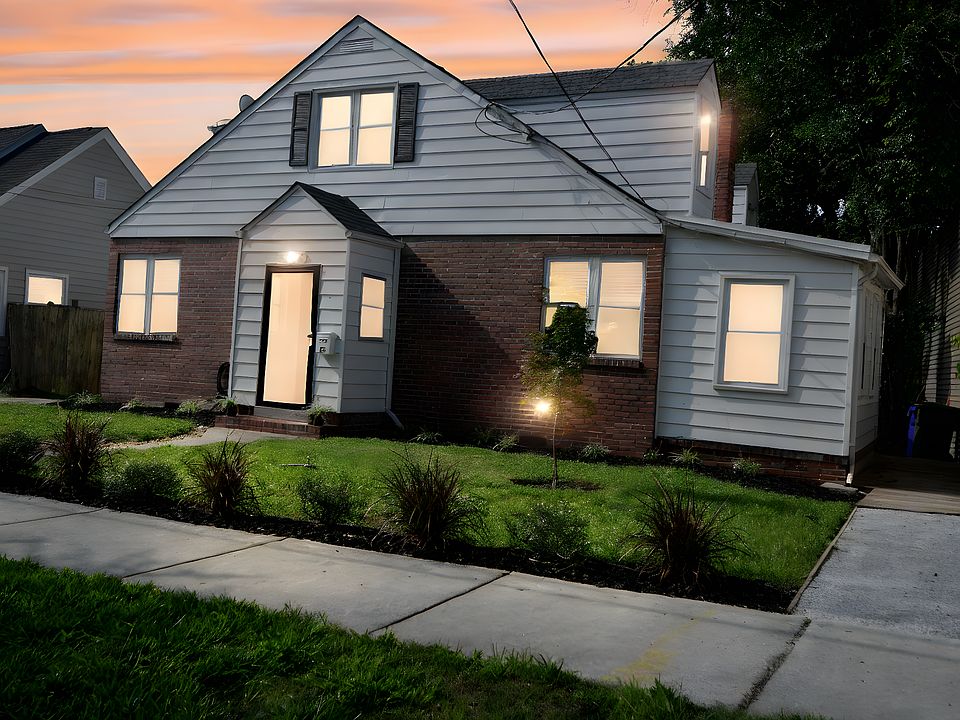 This is the house at dusk, viewed from the right side from the street.