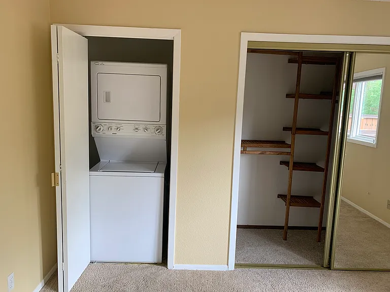 Bedroom with custom closet and Laundry