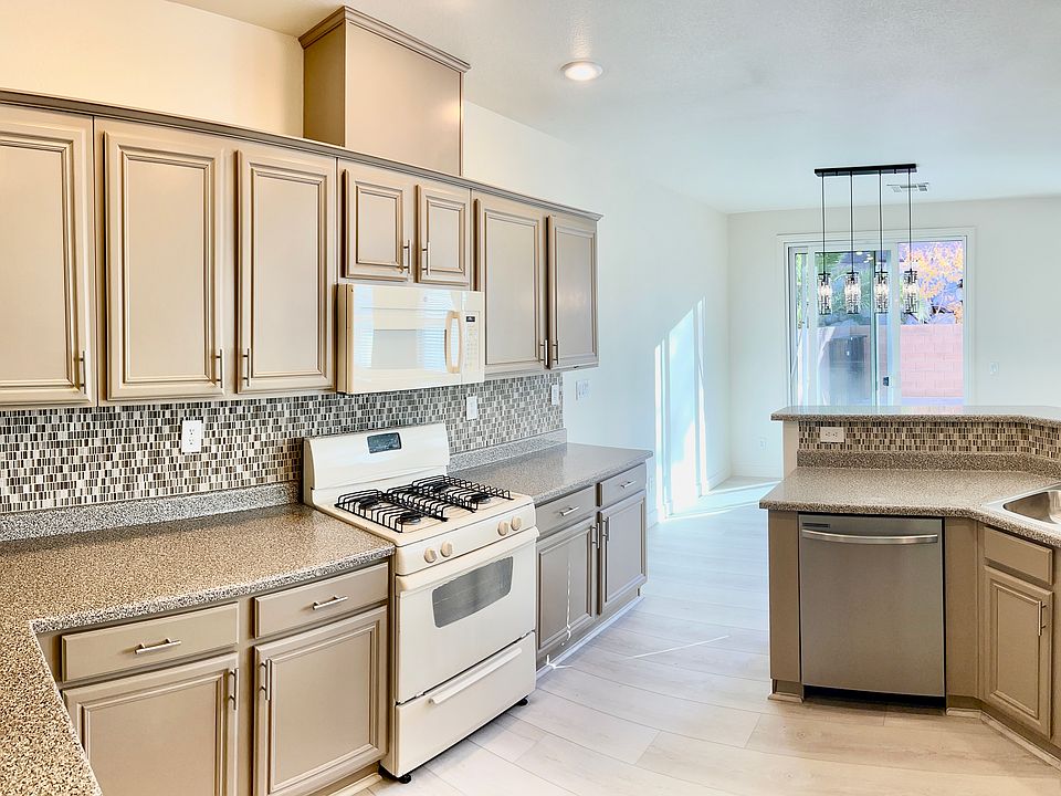 Large kitchen with new refrigerator, new dishwasher and freshly refinished cabinets