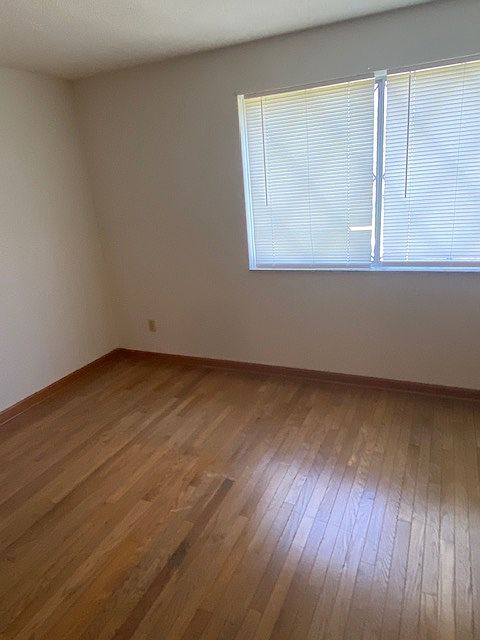 bedroom: upstairs, hardwood floor, closet