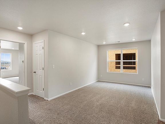 This home includes a loft perfect for some extra space for a home office or a space for the kids.