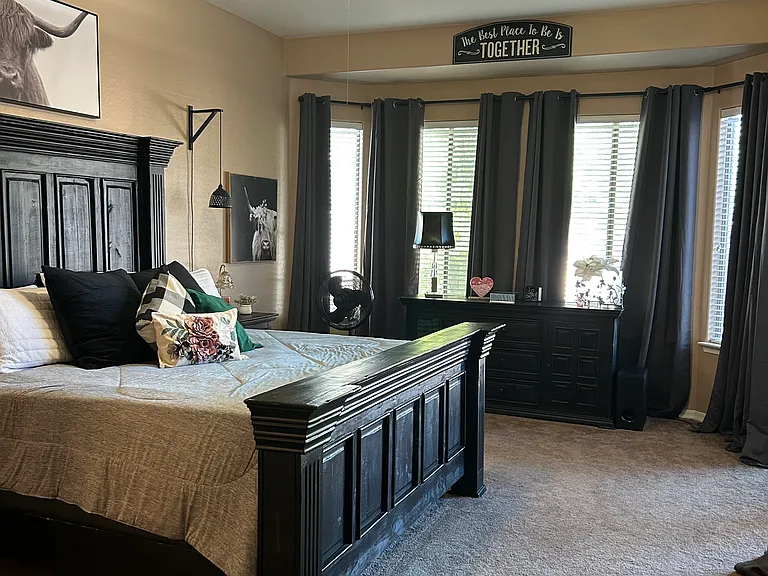 Spacious master bedroom with attached bathroom and walk in closet