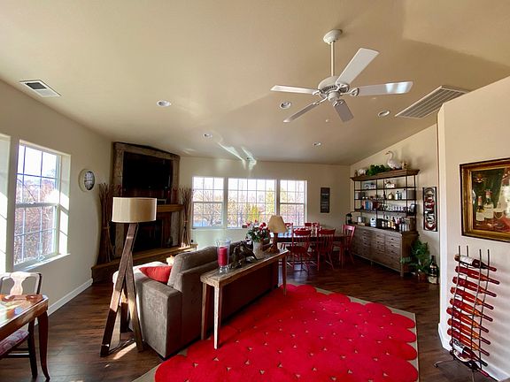 Living, fireplace, and dining area