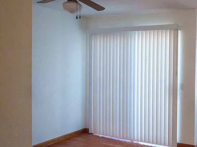 Dining Area with Vertical Blinds to Deck