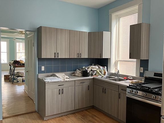 Kitchen with new cabinets and appliances. view to living room.