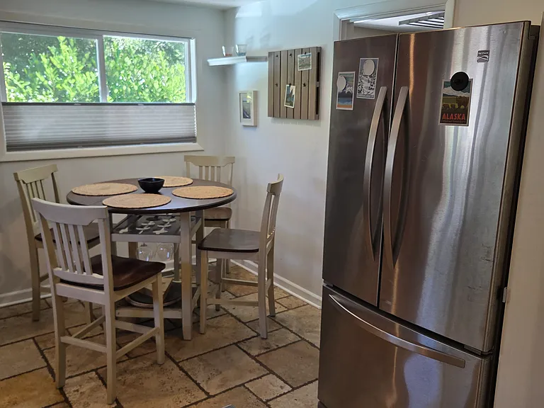 kitchen fridge and dining/breakfast area