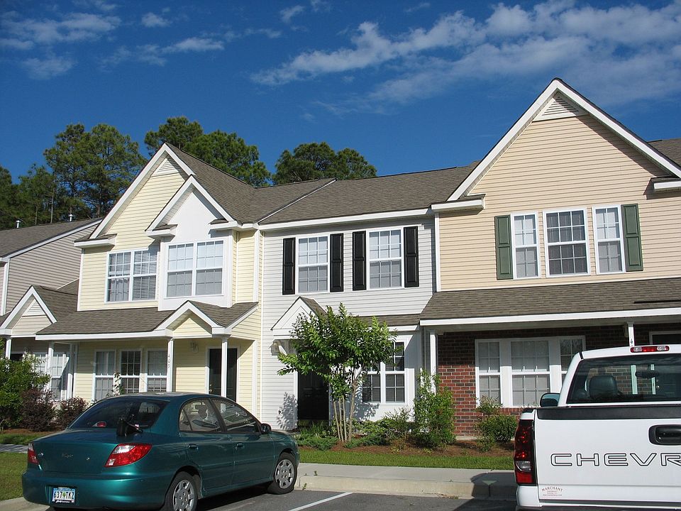 The grey townhome - in the middle.