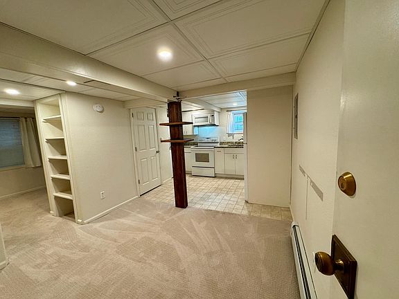 Stepping into the unit. This is the main room. Closet leading into the bedroom is to the left.