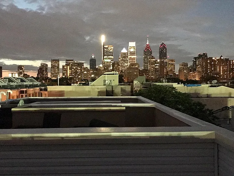 Roof deck view of Center City skyline at night (15 min walk to Rittenhouse Square)