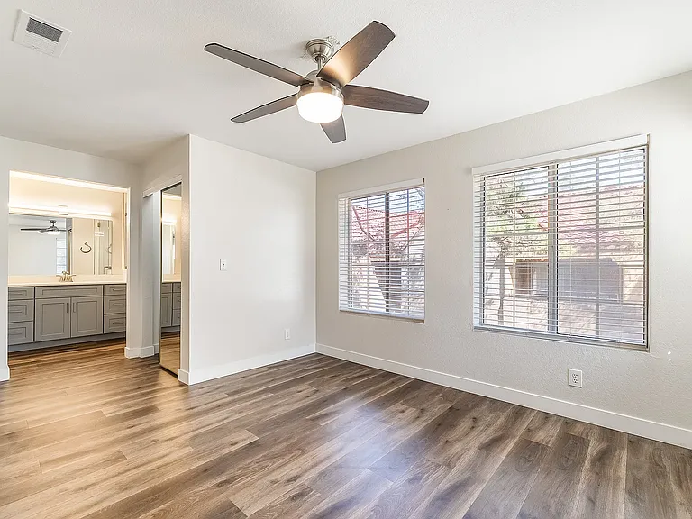 Primary Bedroom with large windows and blinds. Walk in Closet, Primary en-suite bathroom Shower, cabinetry, and separate Water Closet for privacy