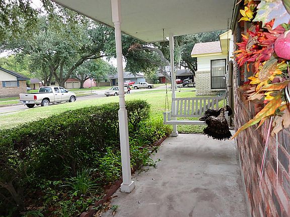 Inviting front porch - with your own porch swing - perfect place to relax.