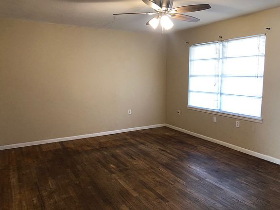 Livnig room, large window, wood flooring