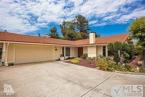 Roll up garage doors and private driveway.