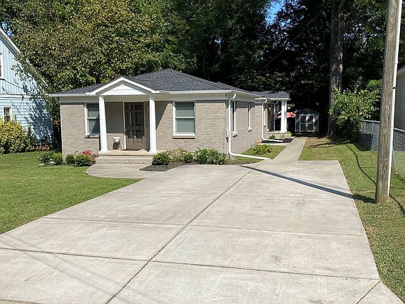 Street view of detached duplex. Unit 2 is down the sidewalk on the right for more privacy. 2 car driveway (Unit 2 parking to the right).
