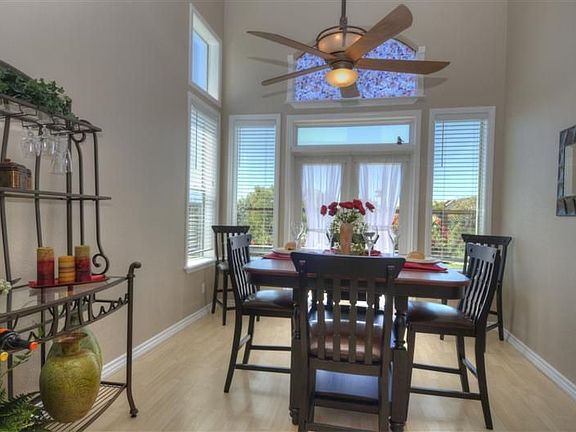 Formal dining room with French doors to backyard.