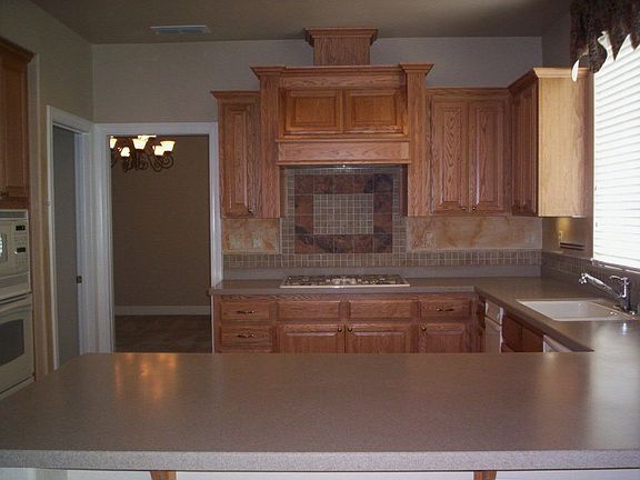 Gourmet Kitchen, Corian Counters, Walk-in Pantry, Tile Floors 