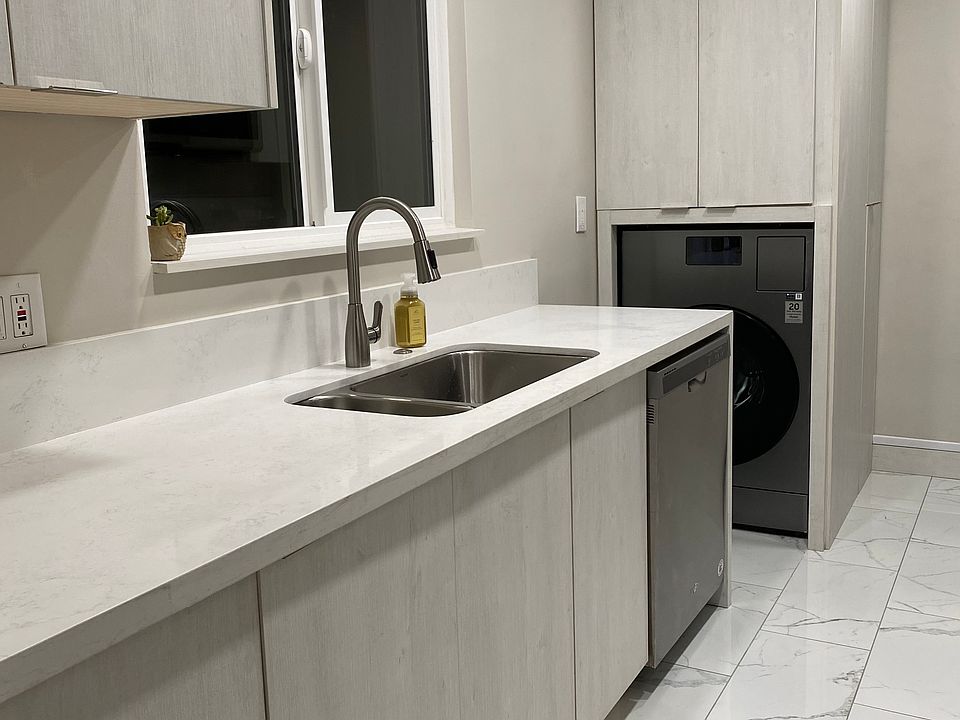 Remodeled kitchen with new cabinets and countertops. Dishwasher and two large pantries for storage.