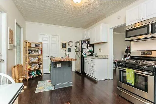 Kitchen with Entry to backyard, leading to Family Room