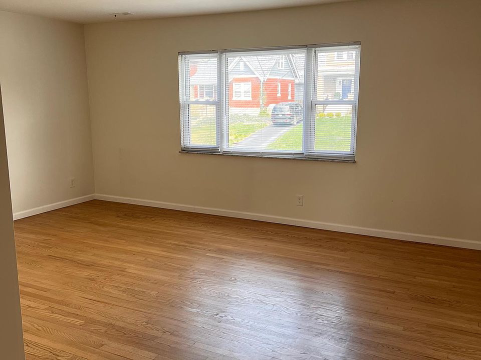 View into Living Room from Kitchen showing large front window