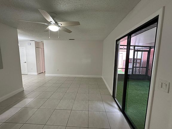 LIVING ROOM, 
VIEW OF SLIDING DOOR LOOKING INTO COVERED PORCH AREA.