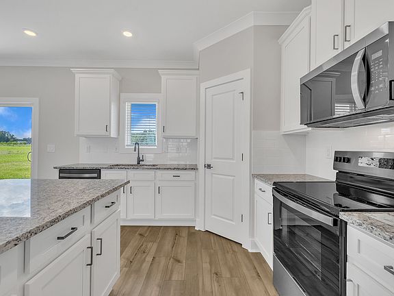 The kitchen is attached to the living area.