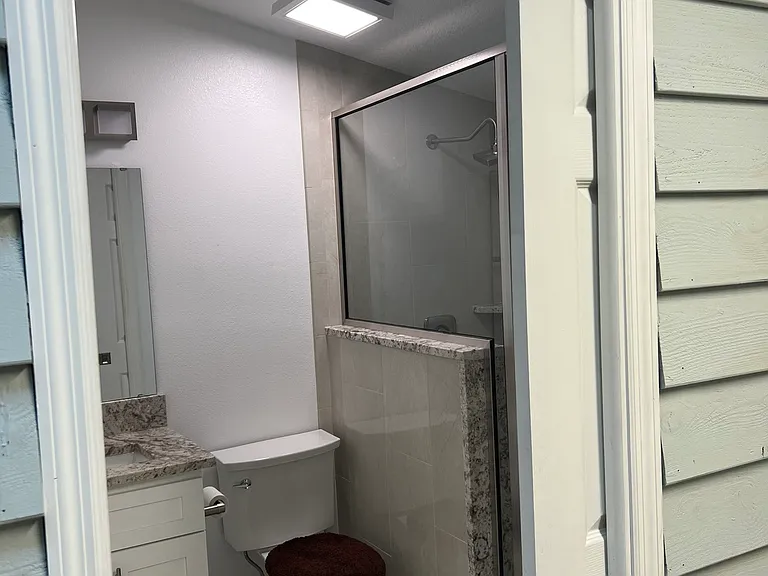 Another view of the bathroom going in. There is a sliding door to the room for privacy.
