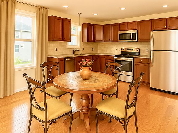 Maple wood cabinets, granite countertops and stainless steel appliances.