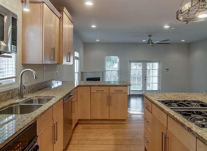 Kitchen includes all appliances: dishwasher, garbage disposal, range, oven, microwave and refrigerator.