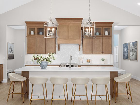 Kitchen with pendant lighting and glass upper cabinets