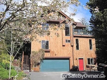Front of House
						:
						L shape paved driveway. Red door is access to shop.