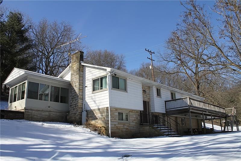 Cozy split level home on more than 27 acres of land. Enjoy surveying your property from the large deck, with new rails, that wra
