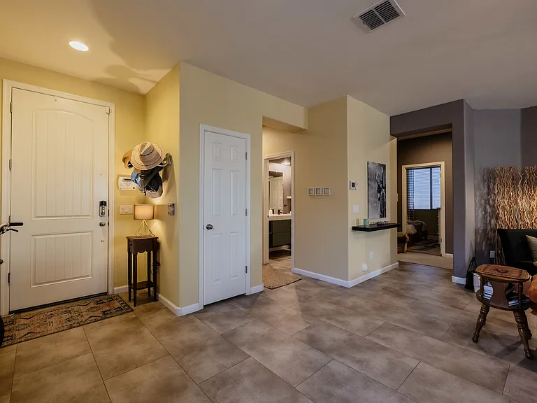 The house is laid out beautifully in that the two bedrooms off the main living space are tucked away and very private. The bath opens both into the hallway and into the bedroom area, so privacy is at a maximum.