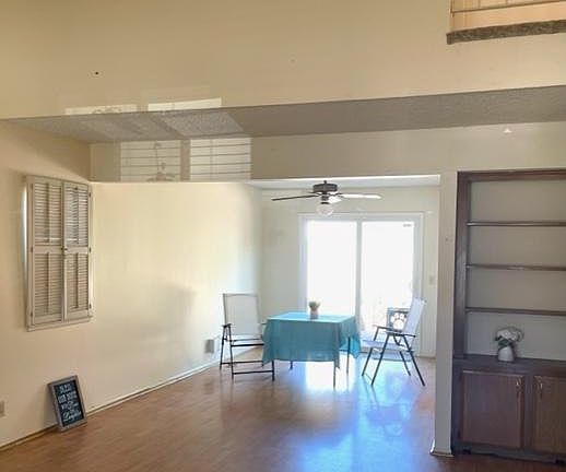 Dining Room, open to the Front Room, off the Kitchen with ceiling fan & access to Patio/Back Yard.