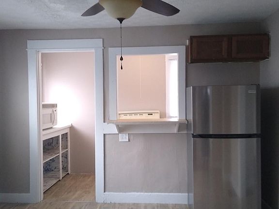 Kitchen and Dining Room Facing Kitchen Pantry