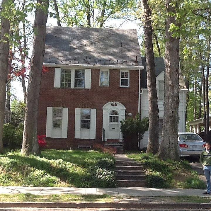 Exterior with huge oaks, off street parking