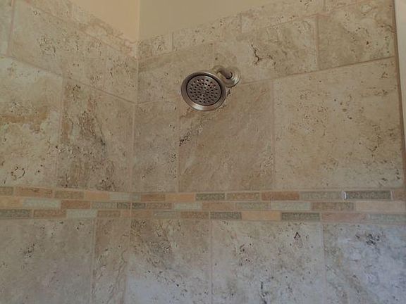 Remodeled Bathroom with Porcelain Tile Throughout