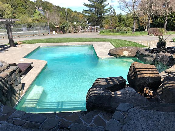Pool from private patio. The tennis court is on the left.