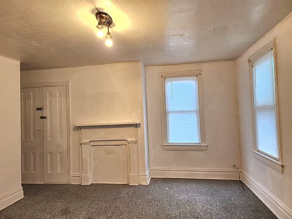 Master Bedroom with a closet and multiple windows for natural light